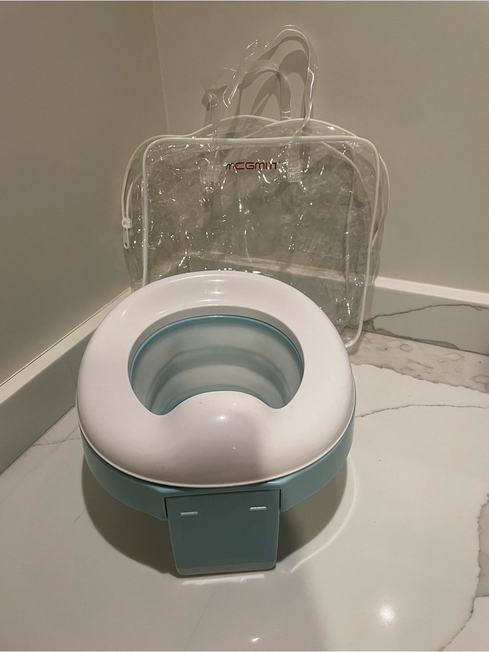 MCGMITT portable folding potty training seat/potty in light blue